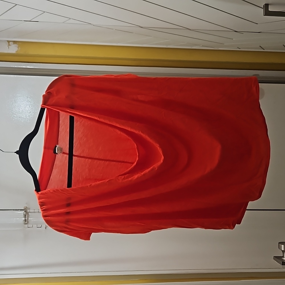 Free People orange/red short sleeved top.